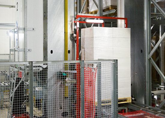 Stacker crane is just moving a fully loaded pallet to the picking zone Stacker crane is just moving a fully loaded pallet to the picking zone