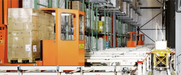An aging warehouse - 3 orange racking biennial units with connecting conveyor system. An aging warehouse - 3 orange racking biennial units with connecting conveyor system.